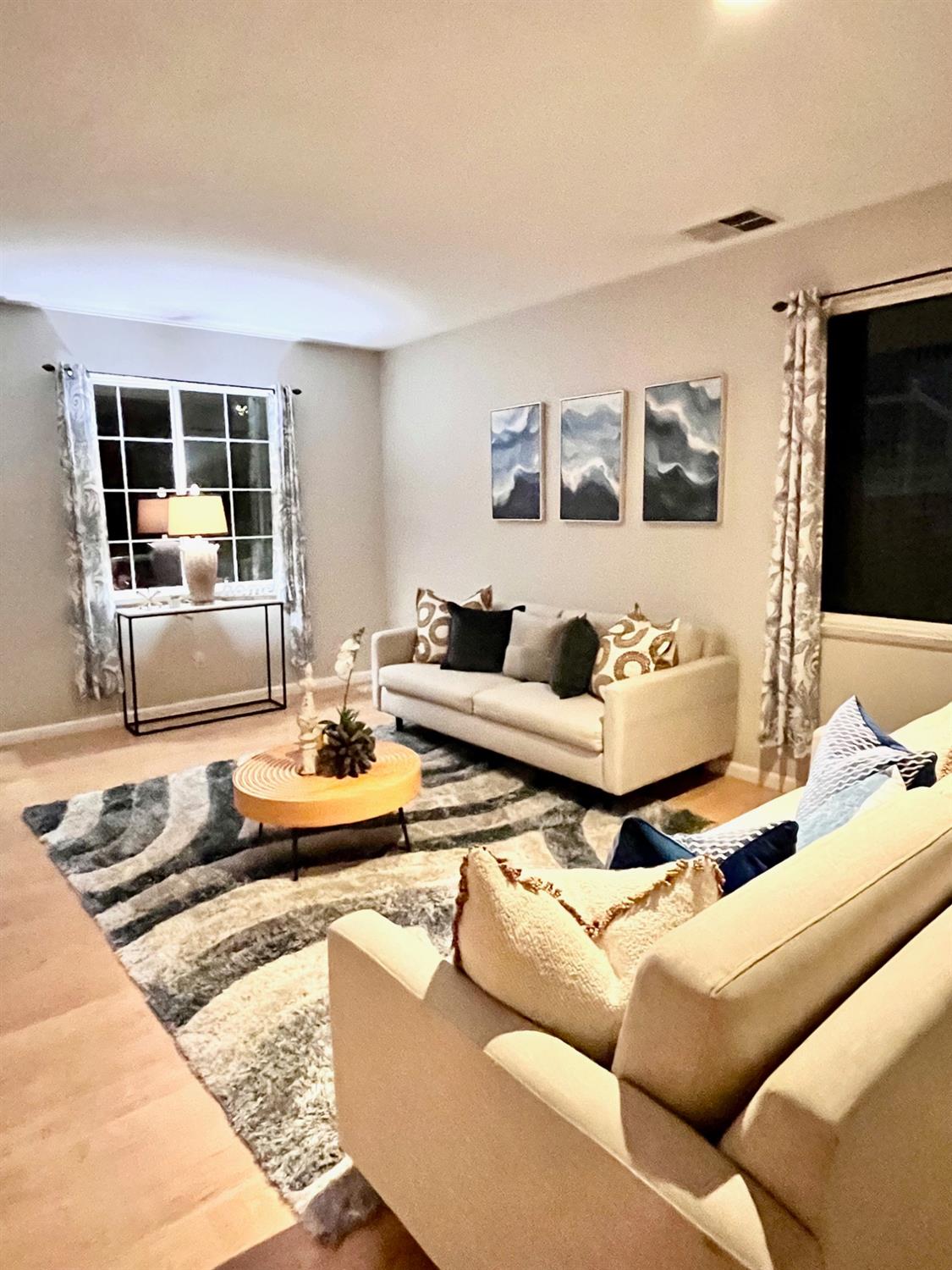 1450 Longhorn Lane Patterson, CA 95363 - Photo 19 of 32 a living room with furniture and a flat screen tv
