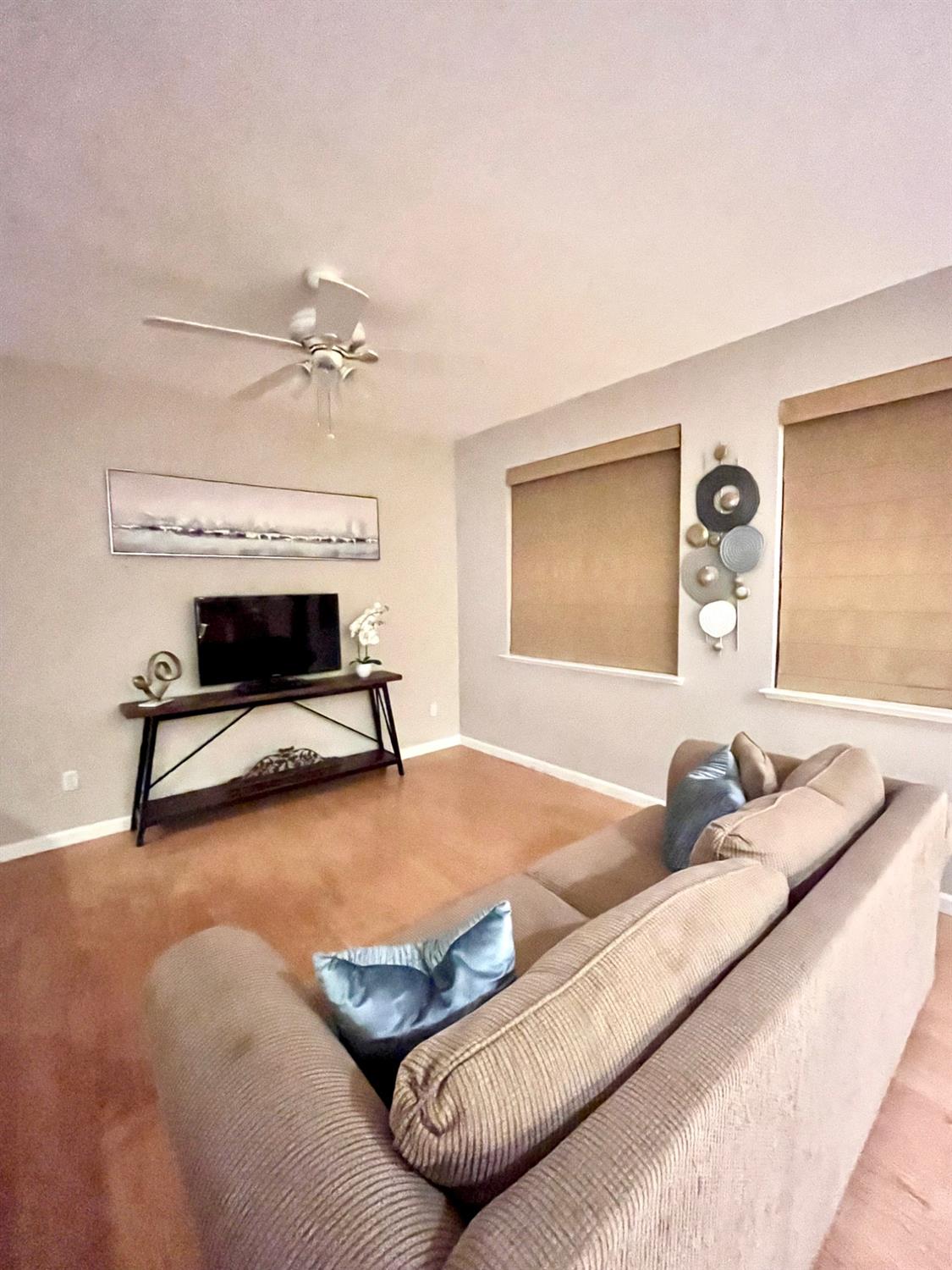 1450 Longhorn Lane Patterson, CA 95363 - Photo 20 of 32 a bedroom with a bed and a chandelier
