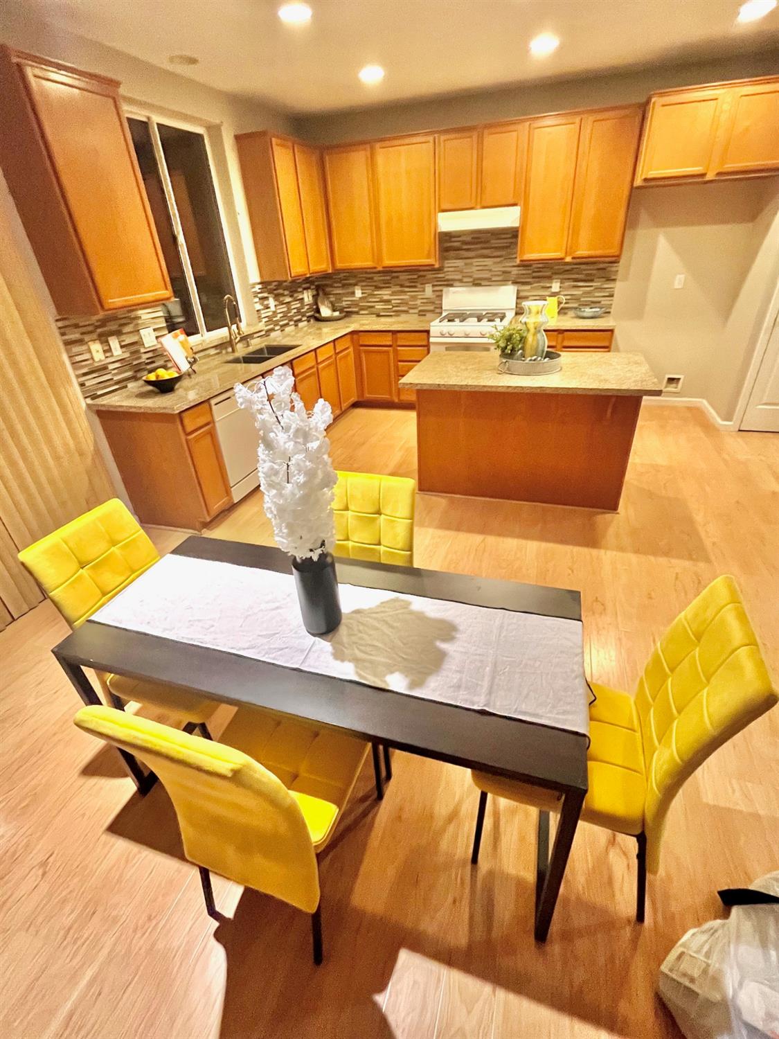 1450 Longhorn Lane Patterson, CA 95363 - Photo 31 of 32 a view of a kitchen with kitchen island a large window