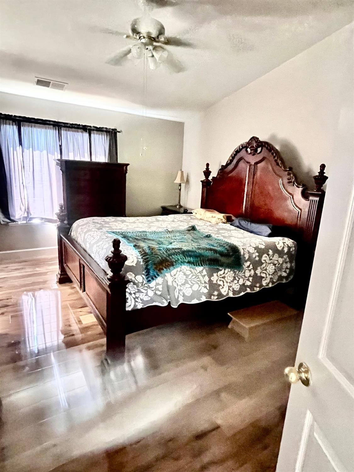 1450 Longhorn Lane Patterson, CA 95363 - Photo 7 of 32 a bedroom with a bed and window