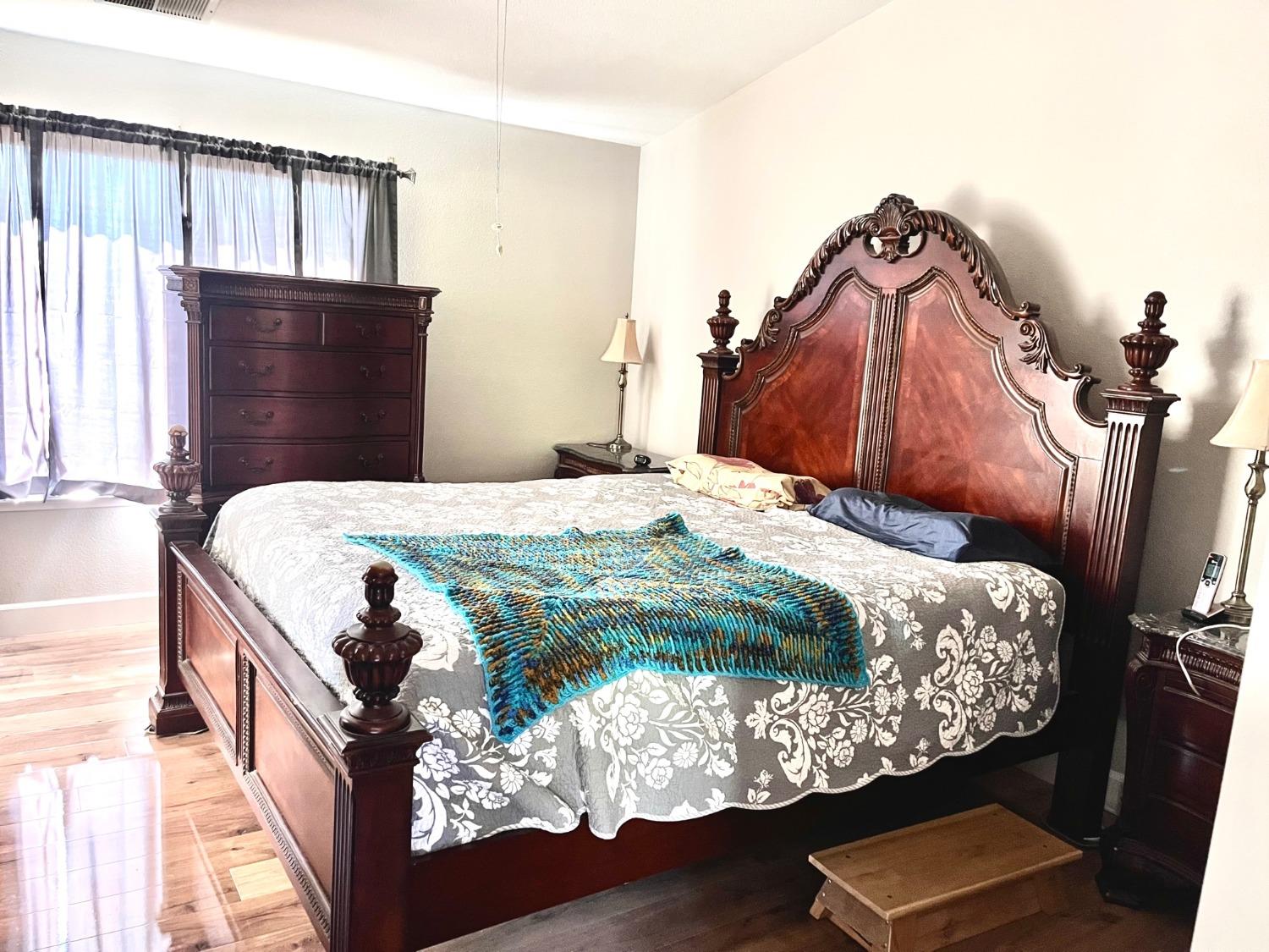 1450 Longhorn Lane Patterson, CA 95363 - Photo 8 of 32 a bedroom with a bed and window