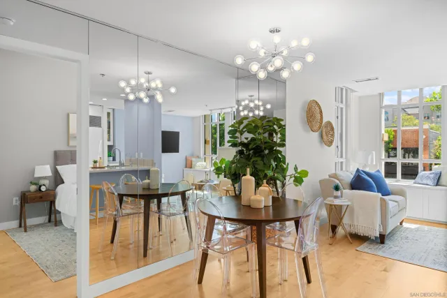 a view of a dining room with furniture and chandelier