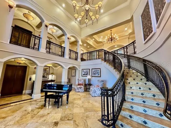 a living room with furniture and a mirror