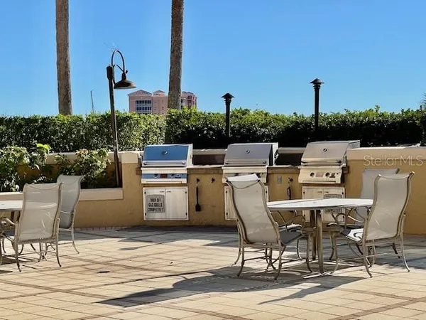 a view of a patio with a table and chairs