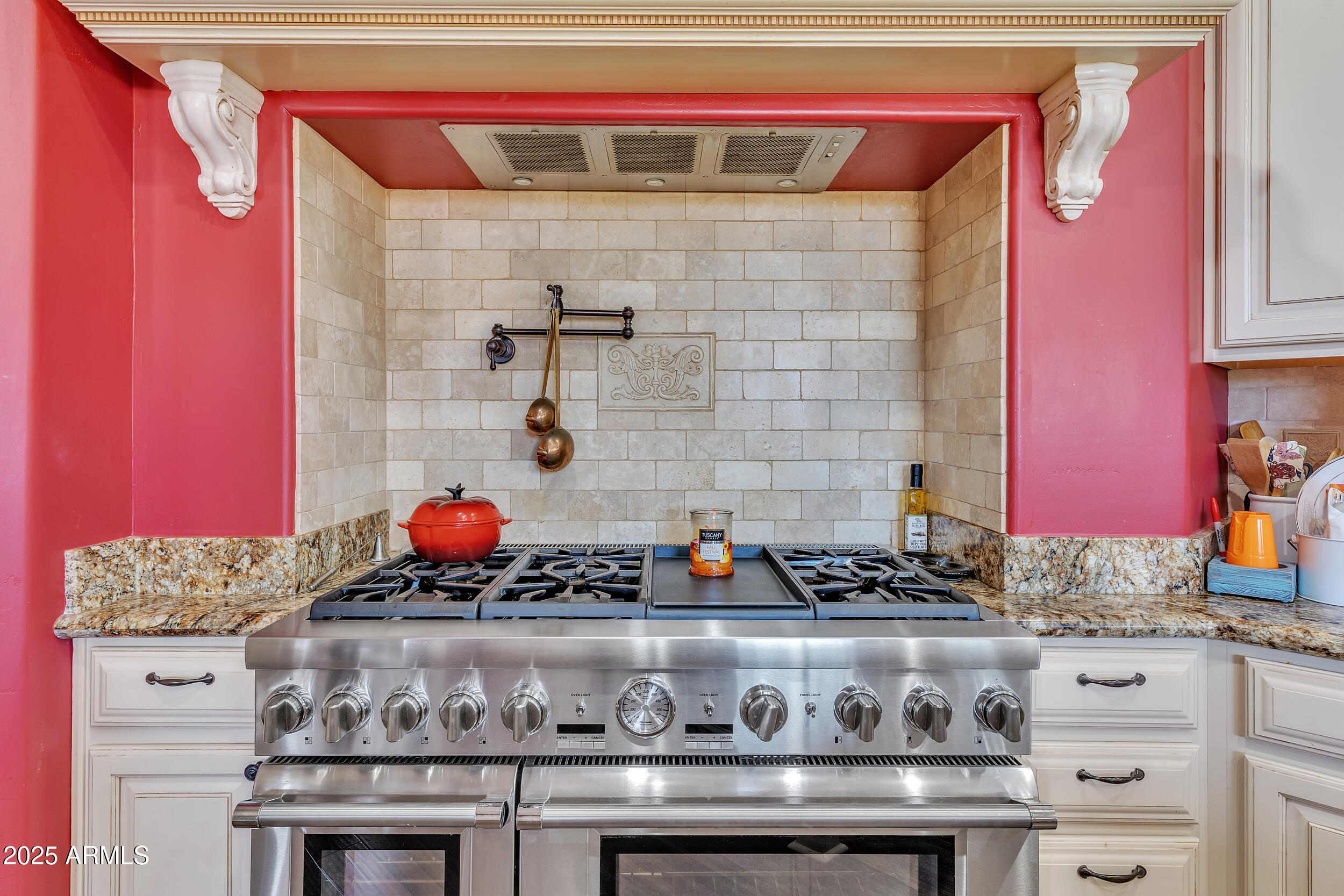 7172 Gelding Lane Coolidge, AZ 85128 - Photo 13 of 45 a bathroom with a stove and cabinets