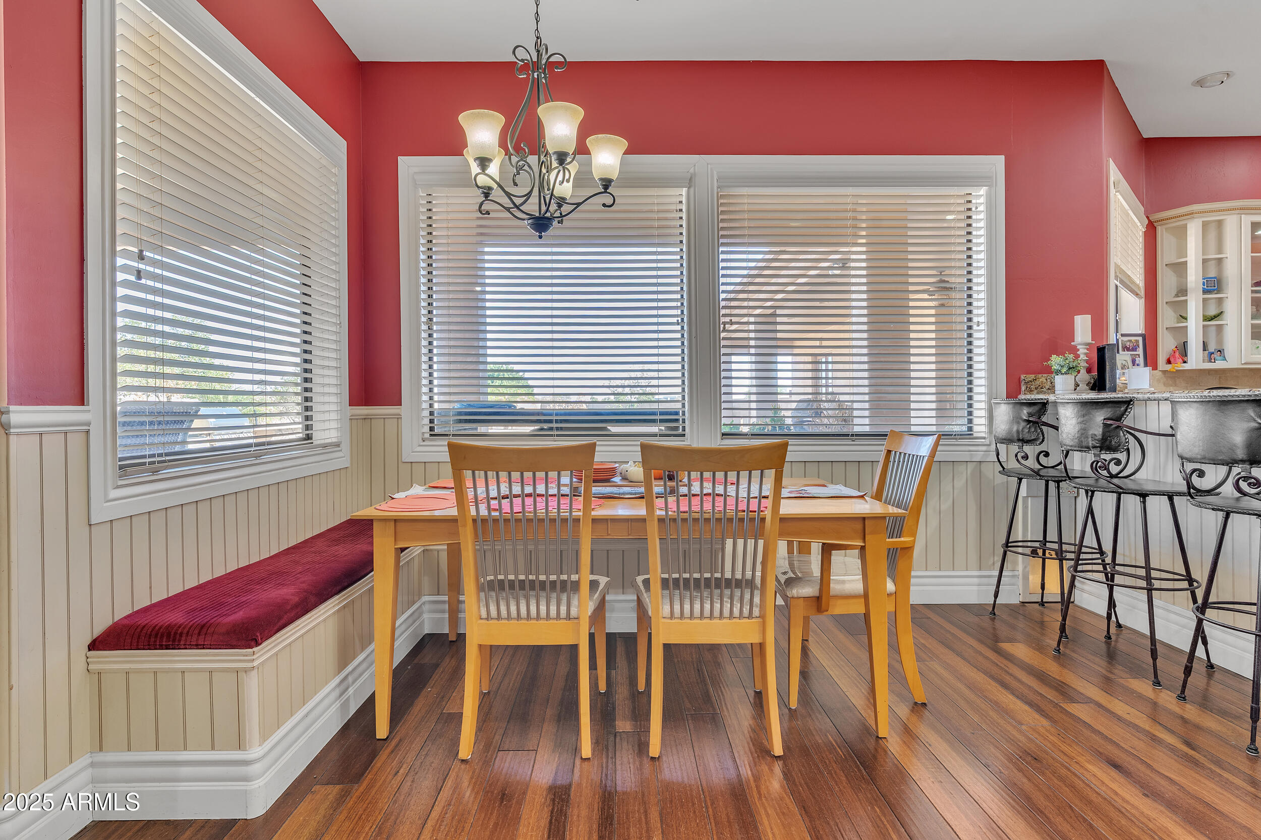 7172 Gelding Lane Coolidge, AZ 85128 - Photo 14 of 45 a dining room with furniture a chandelier and wooden floor