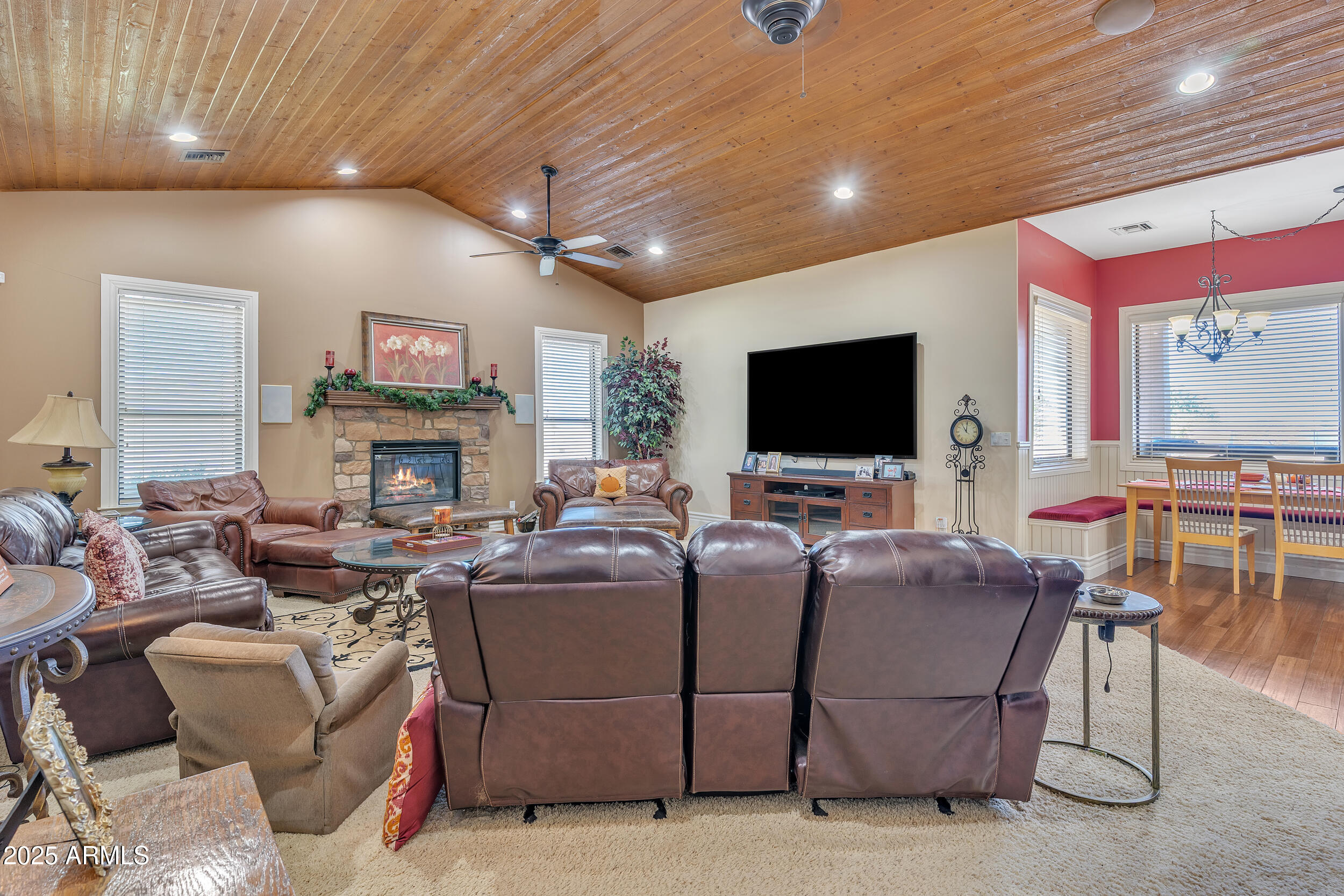 7172 Gelding Lane Coolidge, AZ 85128 - Photo 16 of 45 a living room with fireplace furniture and a flat screen tv