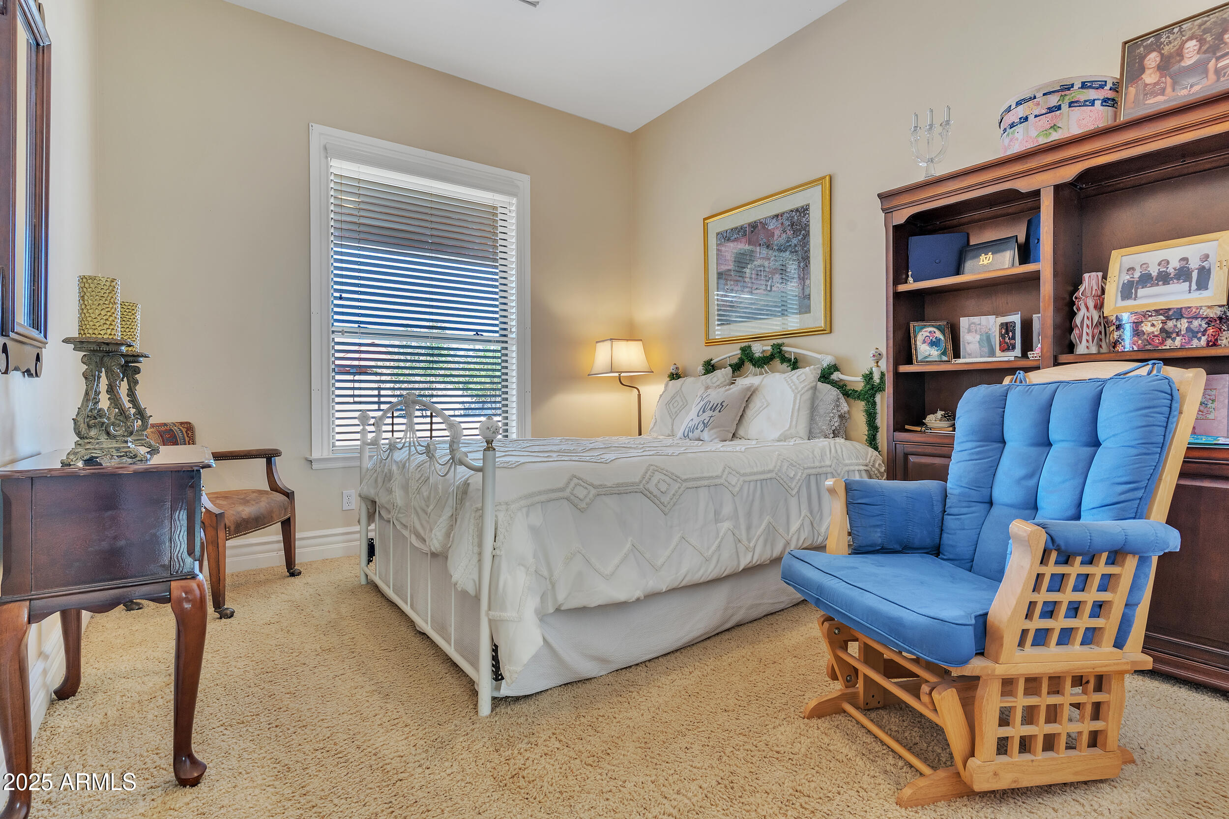 7172 Gelding Lane Coolidge, AZ 85128 - Photo 18 of 45 a bedroom with furniture and a book shelf