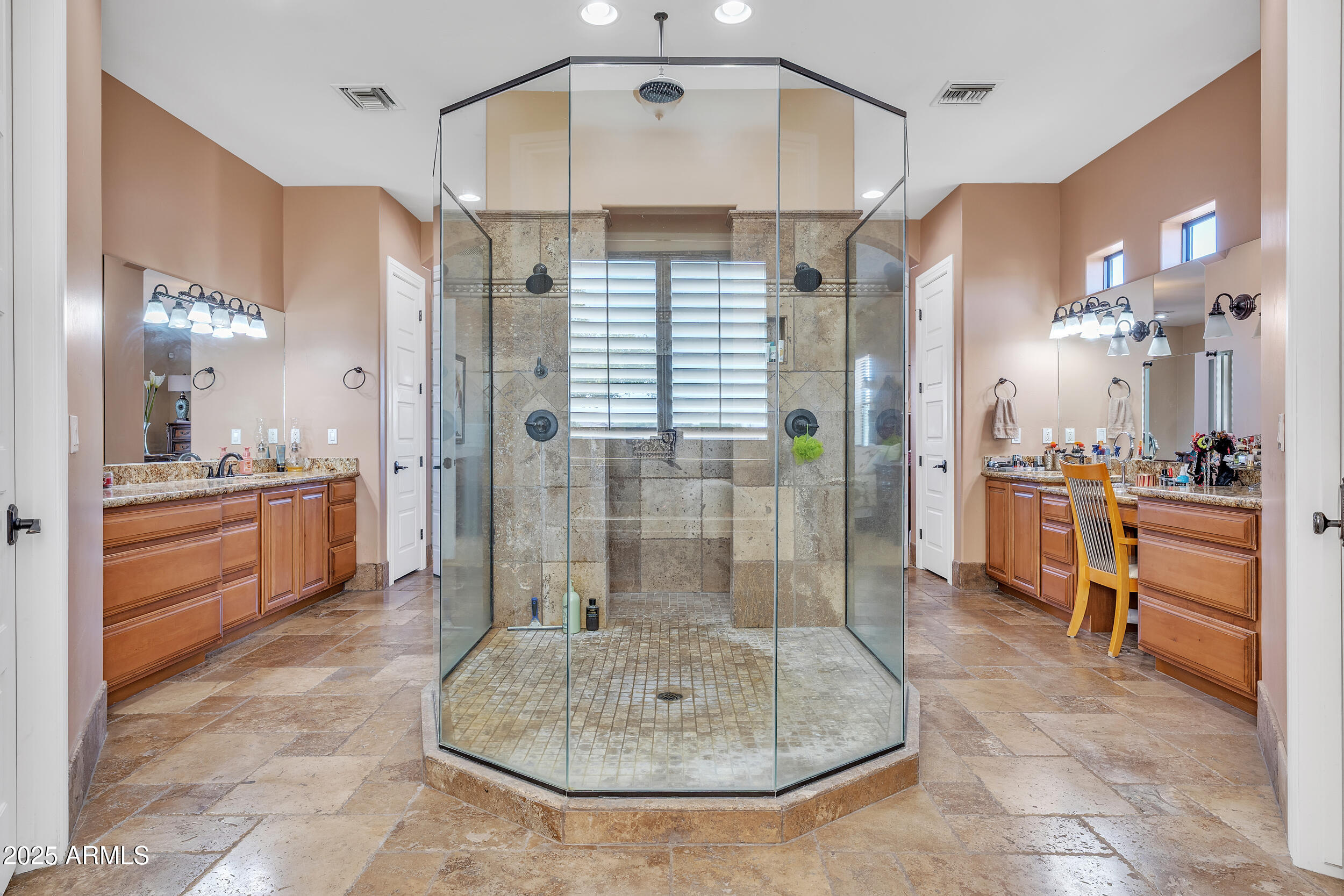 7172 Gelding Lane Coolidge, AZ 85128 - Photo 23 of 45 a bathroom with a double vanity sink a mirror a shower and bathtub