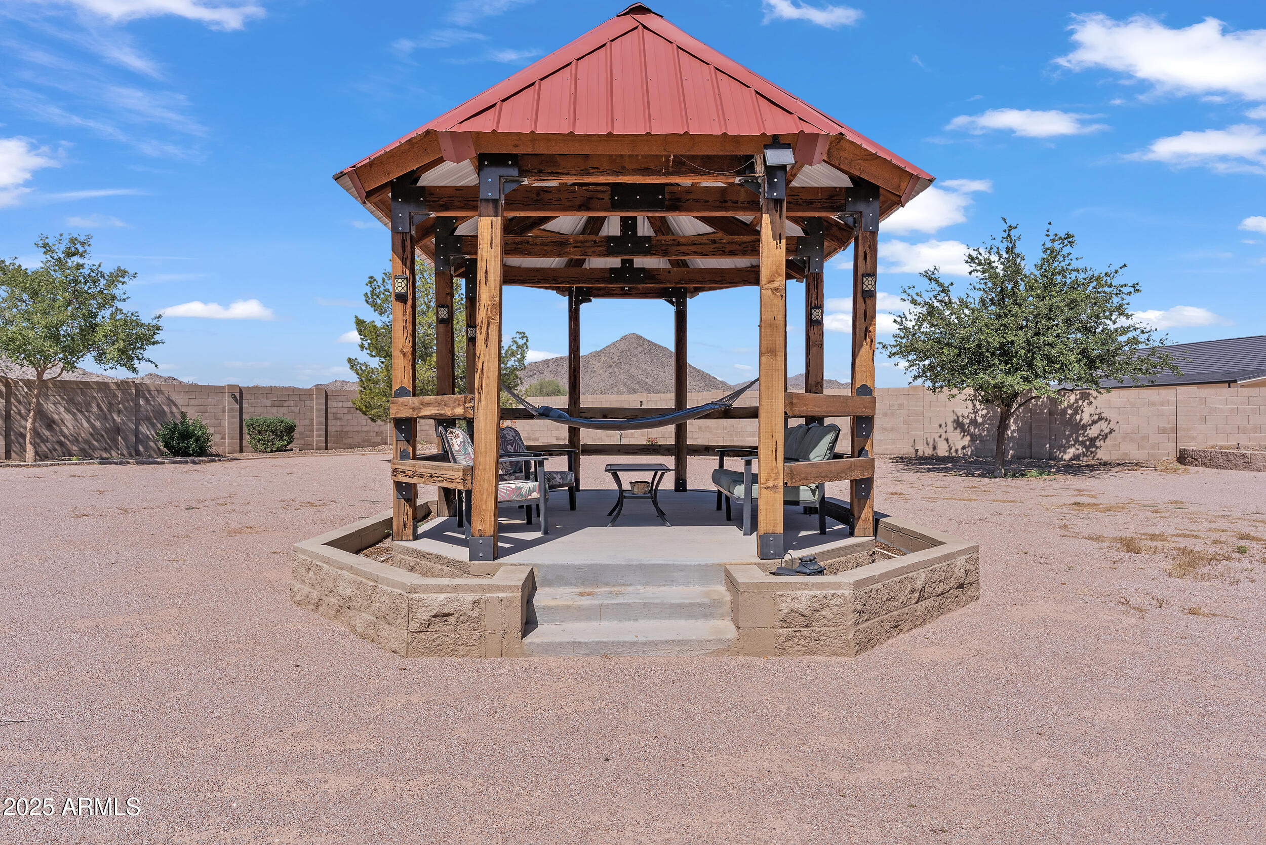 7172 Gelding Lane Coolidge, AZ 85128 - Photo 37 of 45 a view of a chair and tables in the patio