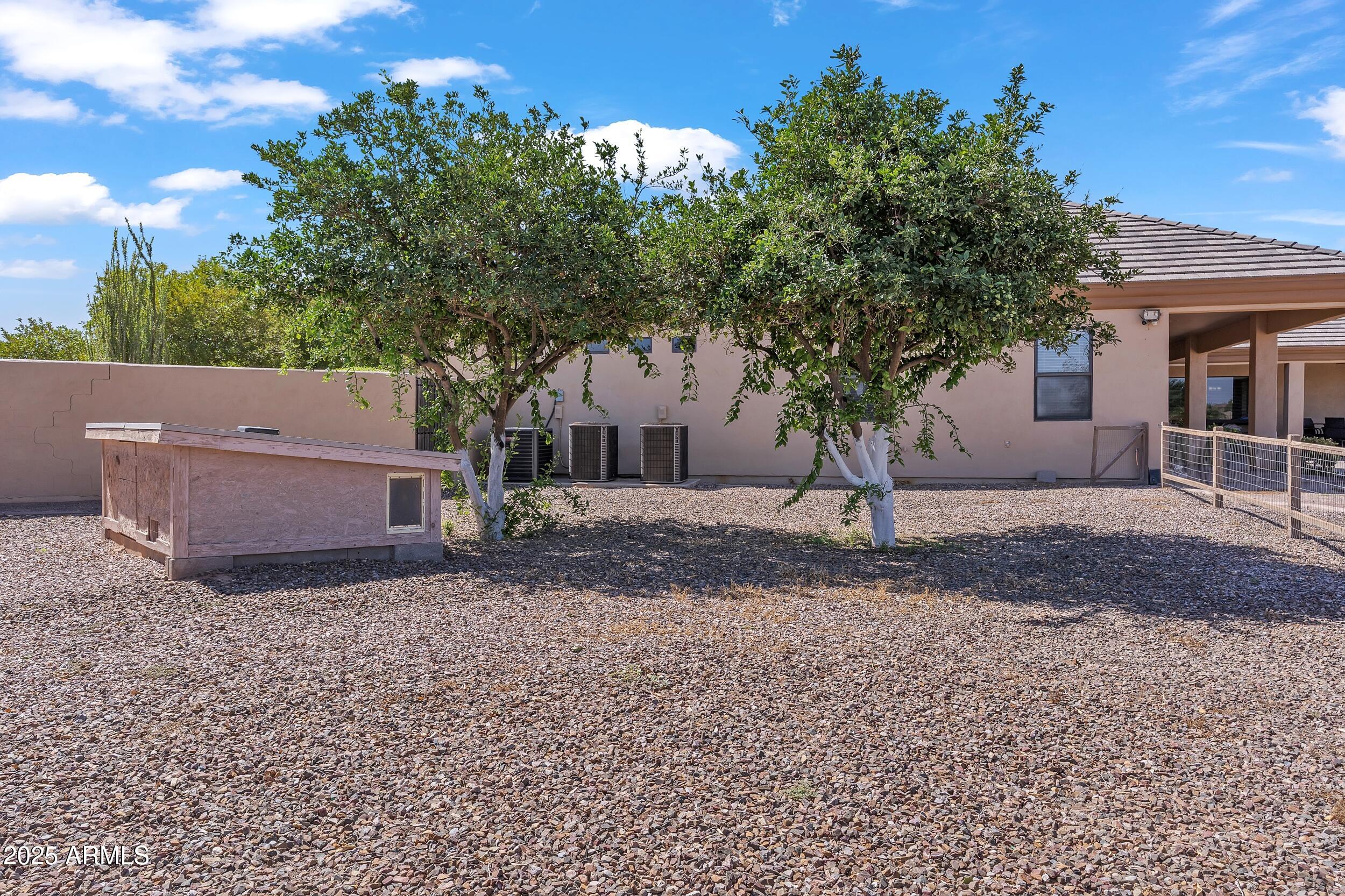 7172 Gelding Lane Coolidge, AZ 85128 - Photo 40 of 45 a view of a house with a yard and a tree
