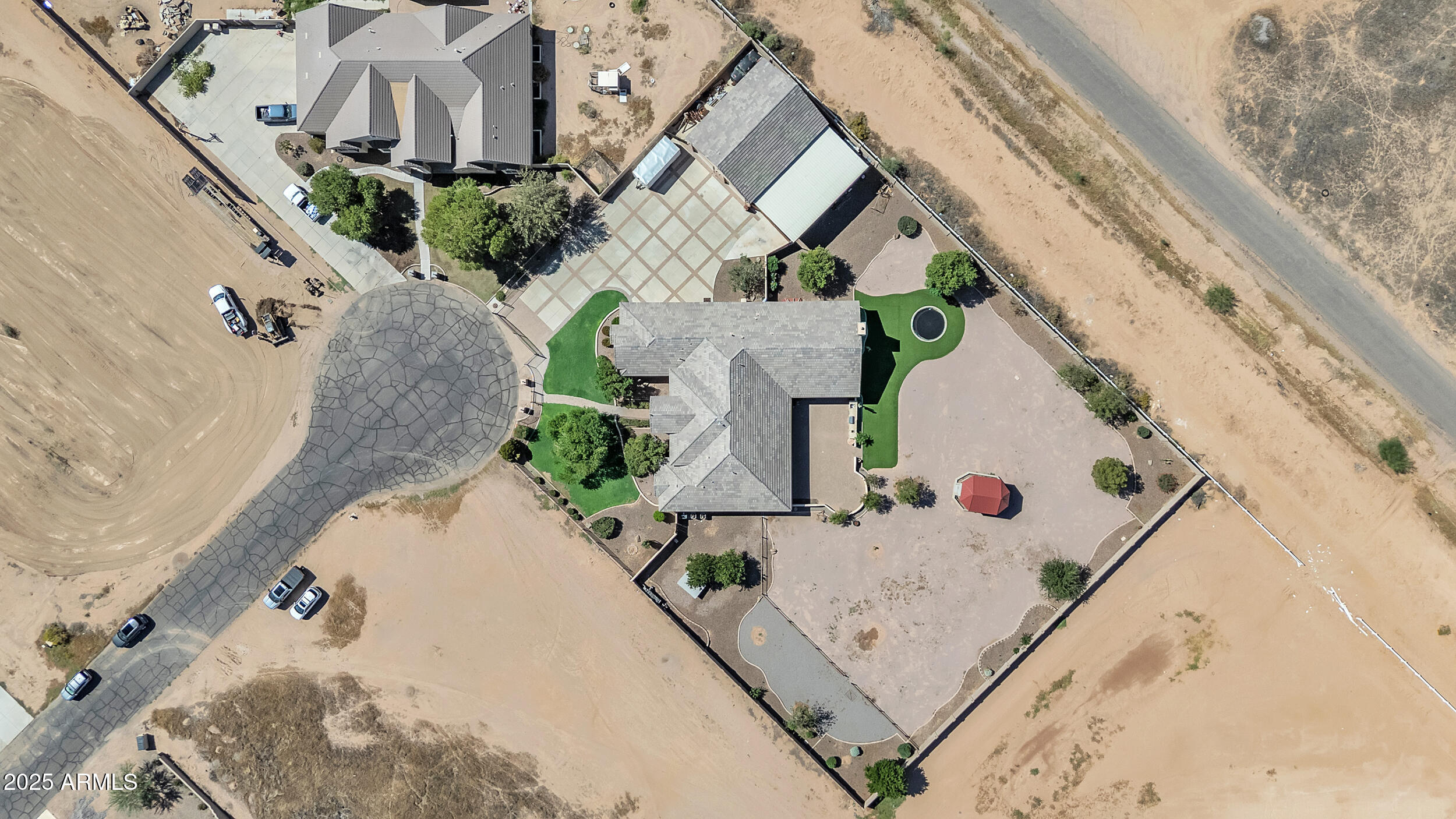 7172 Gelding Lane Coolidge, AZ 85128 - Photo 43 of 45 an aerial view of a house with a yard and large trees