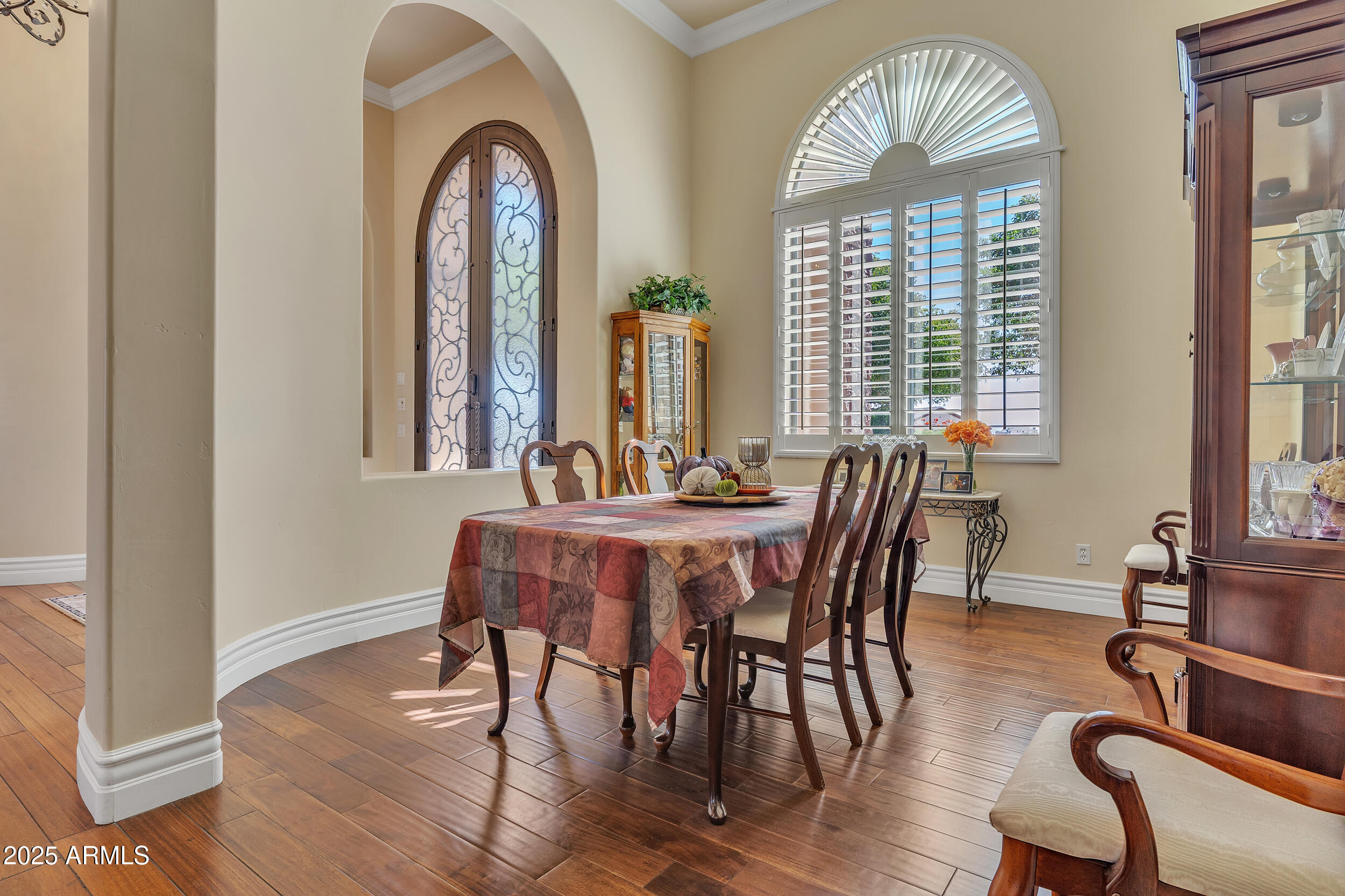 7172 Gelding Lane Coolidge, AZ 85128 - Photo 7 of 45 a view of a dining room with furniture window and wooden floor