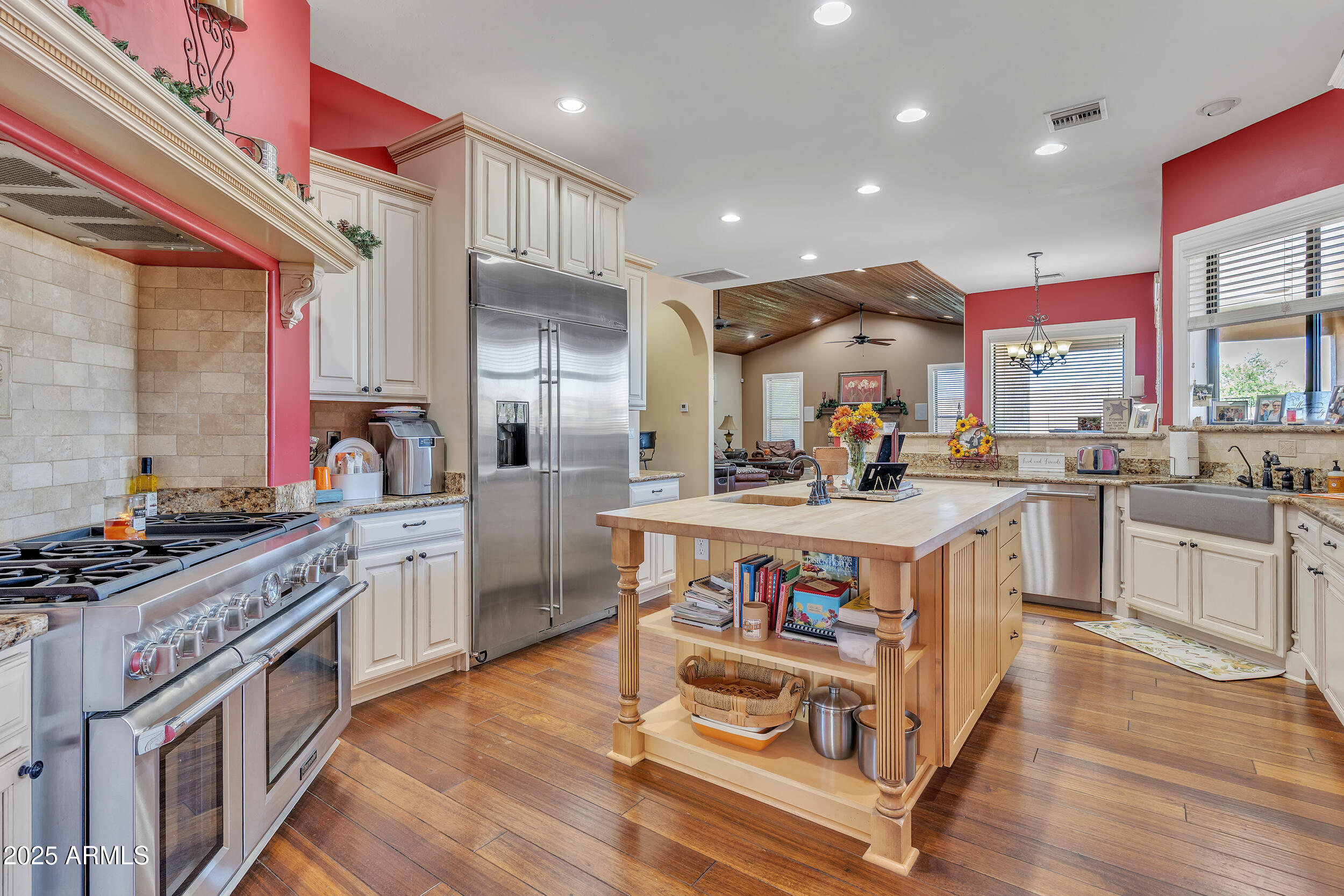 7172 Gelding Lane Coolidge, AZ 85128 - Photo 9 of 45 a kitchen with stainless steel appliances granite countertop a stove refrigerator and a sink