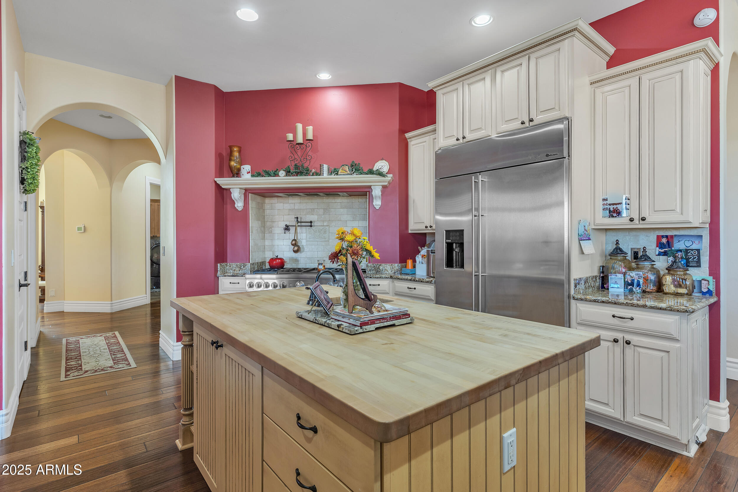 7172 Gelding Lane Coolidge, AZ 85128 - Photo 10 of 45 a kitchen with kitchen island granite countertop a sink stainless steel appliances and cabinets