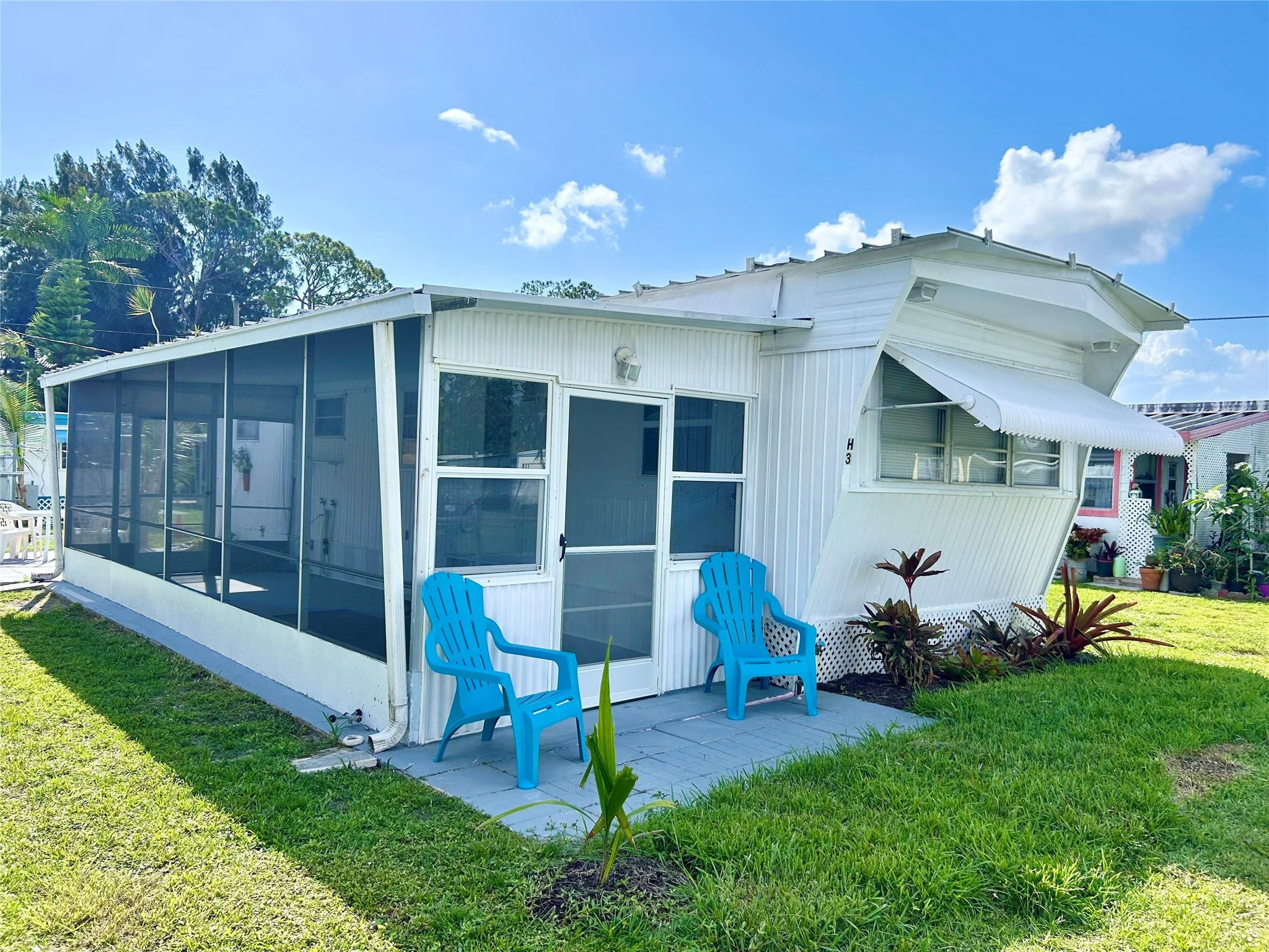 a front view of a house with a yard and porch
