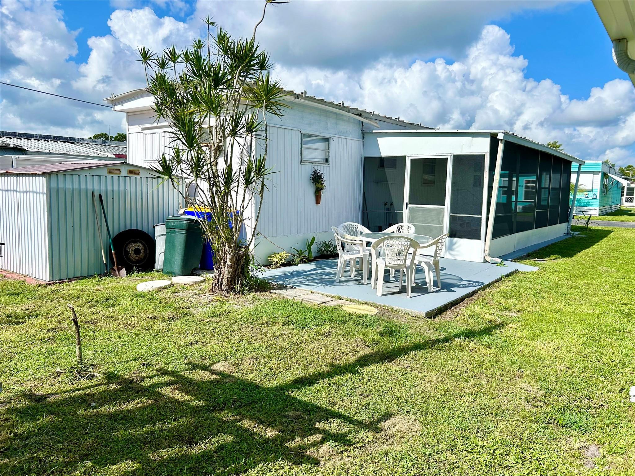 5400 Southeast Jack Avenue Stuart, FL 34997 - Photo 3 of 20 a view of a house with backyard and sitting area