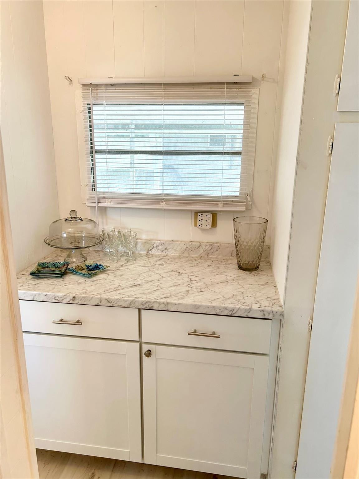 5400 Southeast Jack Avenue Stuart, FL 34997 - Photo 7 of 20 a bathroom with granite countertop white cabinets and a sink