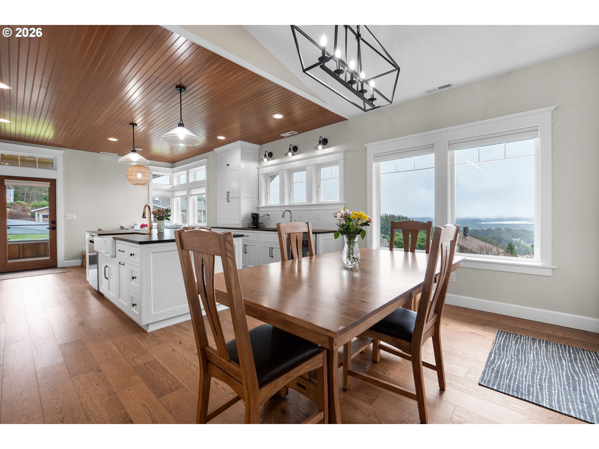 38590 Meadow Loop Nehalem, OR 97131 - Photo 13 of 48 a view of a dining room with furniture and wooden floor