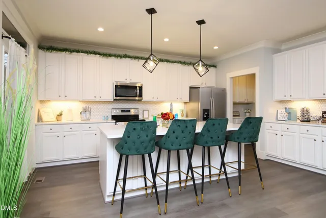 a front view of a house with porch and outdoor seating