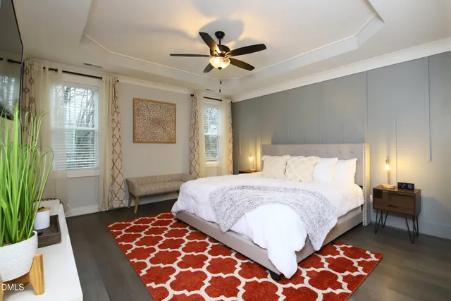 a bathroom with a double vanity sink toilet mirror and shower