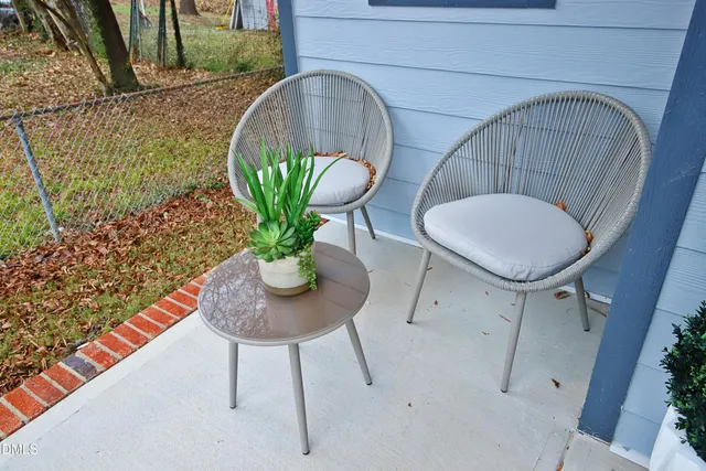 a living room with furniture fireplace and a flat screen tv