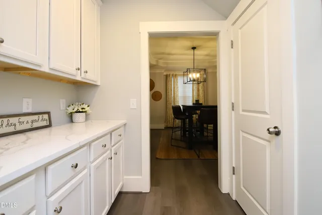 a en suite bathroom with a sink and a mirror