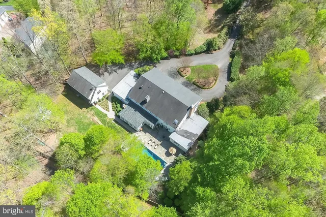 an aerial view of a house with outdoor space