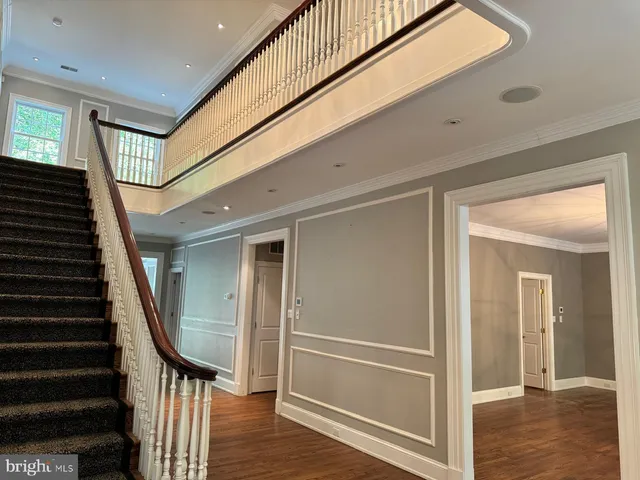 a view of entryway with wooden floor