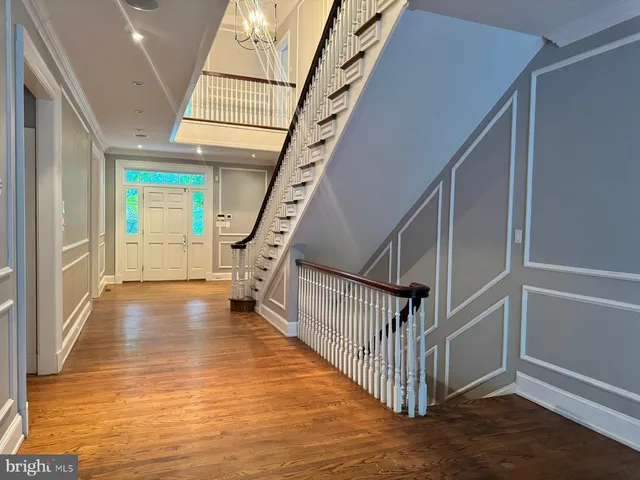 a bathroom with a bathtub a window and a shower
