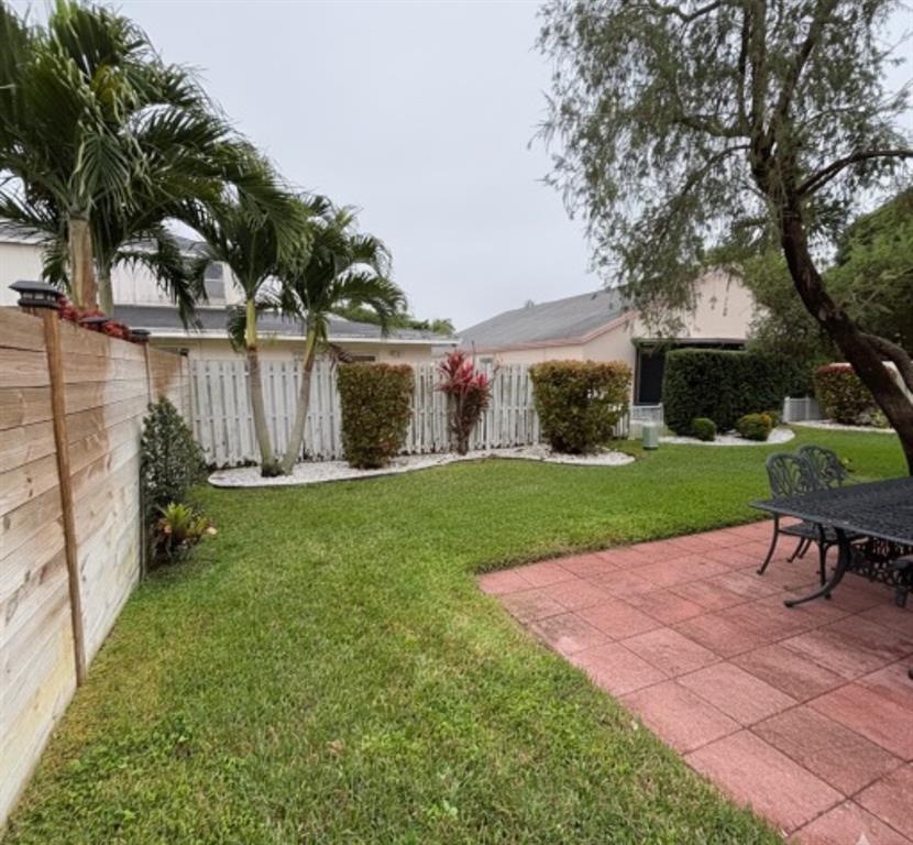 3111 Thames Way Miramar, FL 33025 - Photo 16 of 18 a view of a backyard with a garden