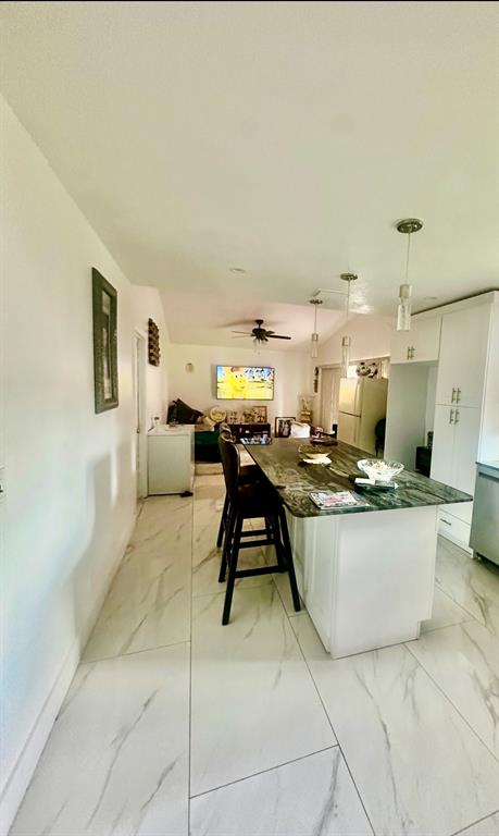 3111 Thames Way Miramar, FL 33025 - Photo 9 of 18 a living room with furniture a rug and a fireplace