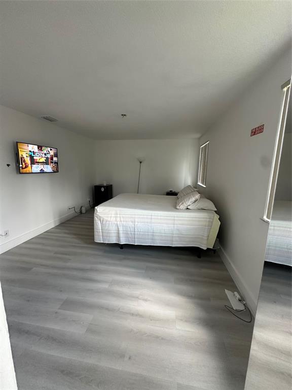 3111 Thames Way Miramar, FL 33025 - Photo 10 of 18 a bedroom with a bed and a couch