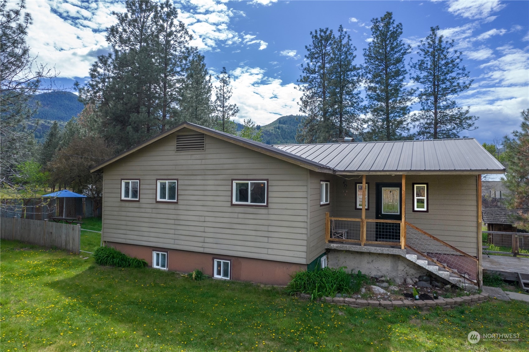 36 Twisp Airport Road Twisp, WA 98856 - Photo 1 of 38 a view of a house with a backyard
