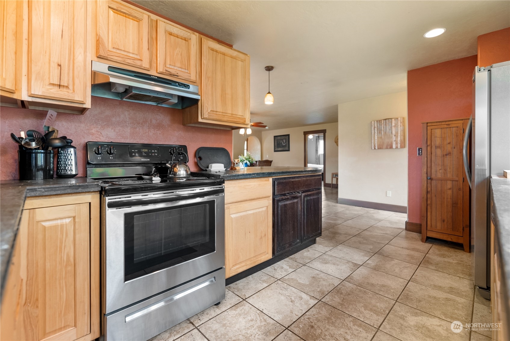 36 Twisp Airport Road Twisp, WA 98856 - Photo 19 of 38 a kitchen with stainless steel appliances granite countertop a stove a refrigerator and a sink