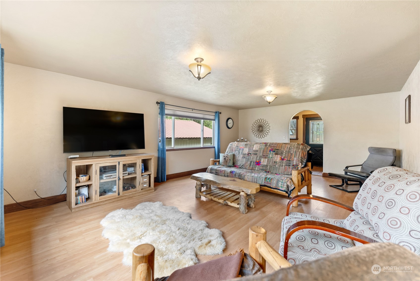 36 Twisp Airport Road Twisp, WA 98856 - Photo 23 of 38 a living room with furniture and a flat screen tv