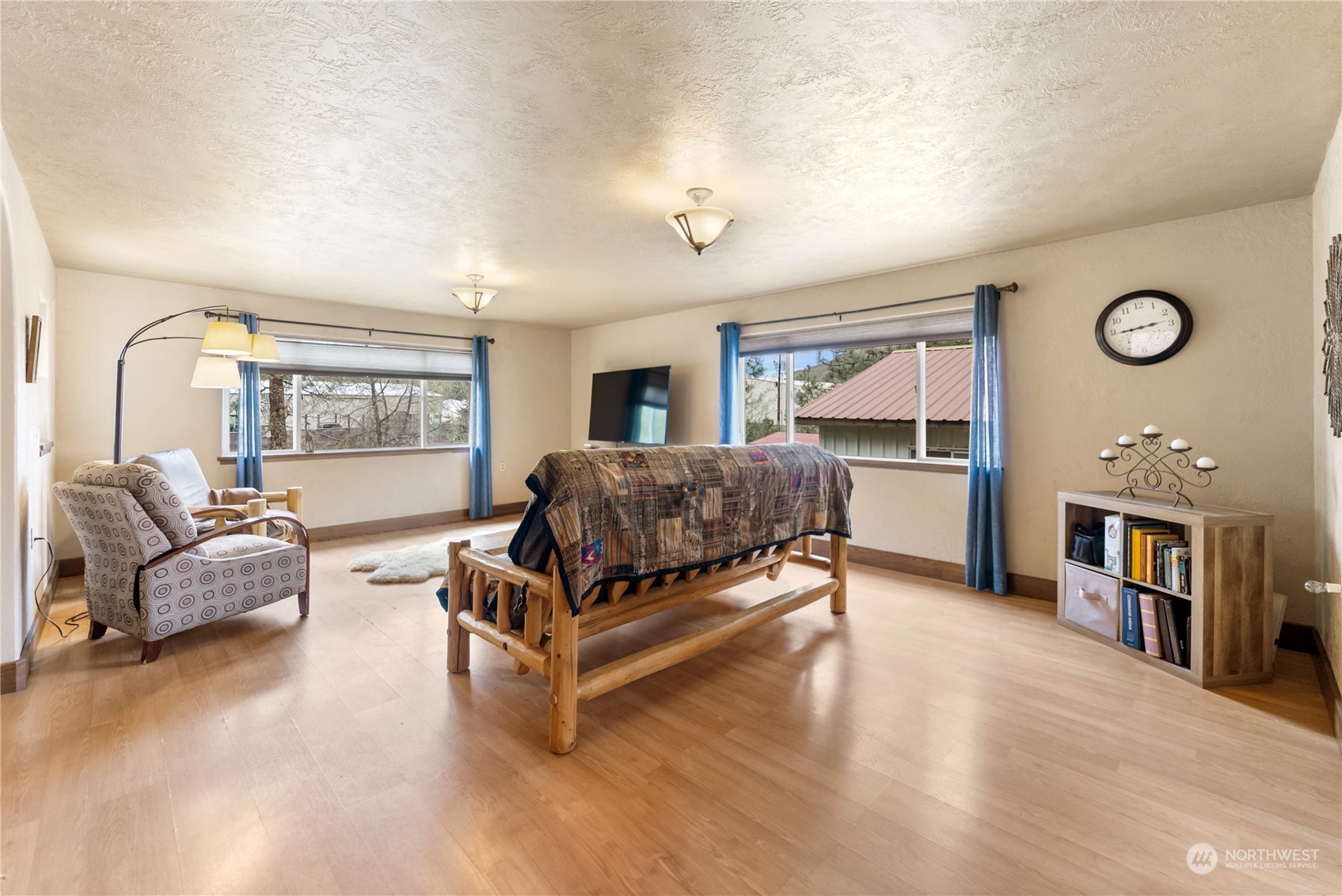 36 Twisp Airport Road Twisp, WA 98856 - Photo 24 of 38 a living room with a bed furniture and a large window