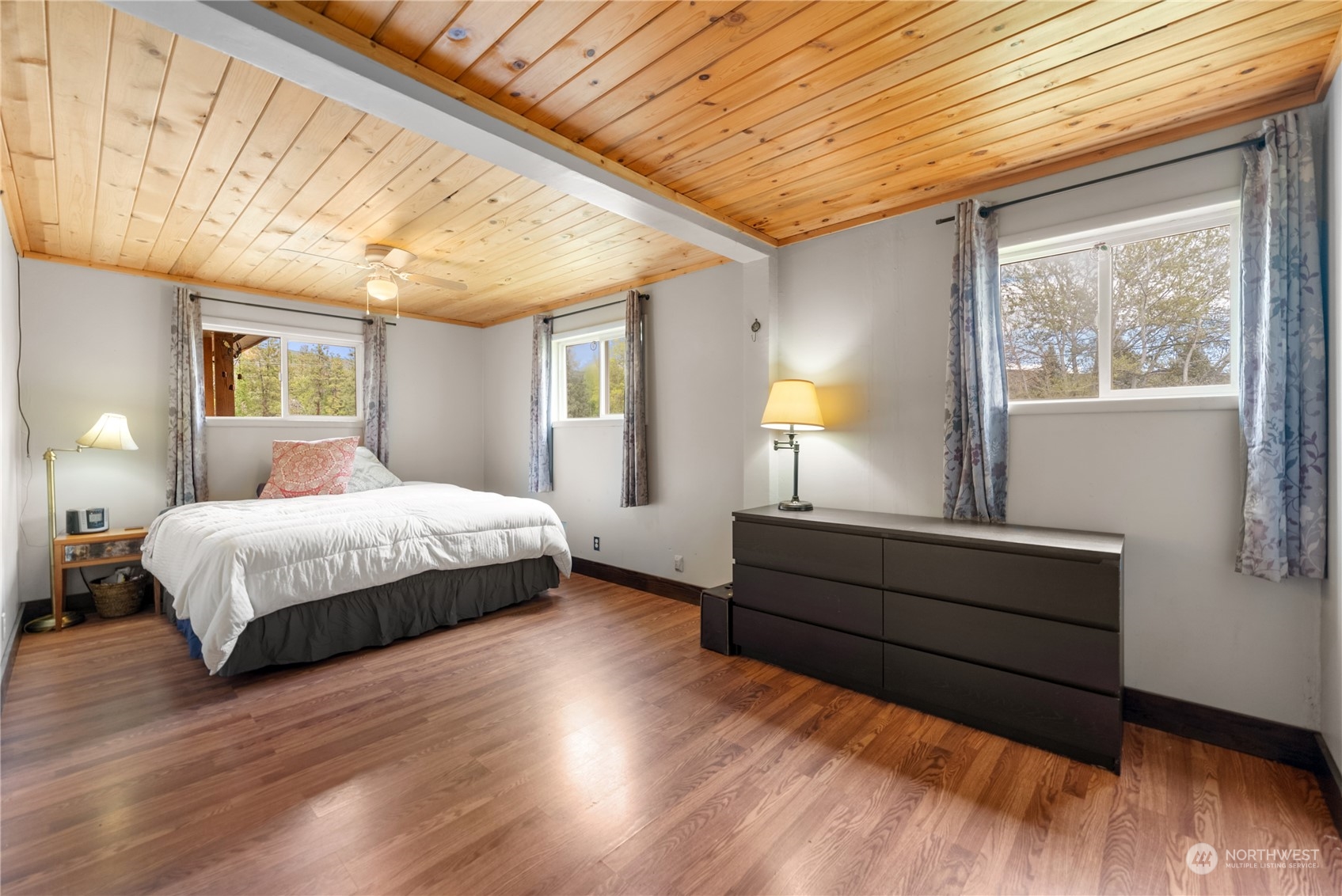 36 Twisp Airport Road Twisp, WA 98856 - Photo 25 of 38 a spacious bedroom with a bed and a window