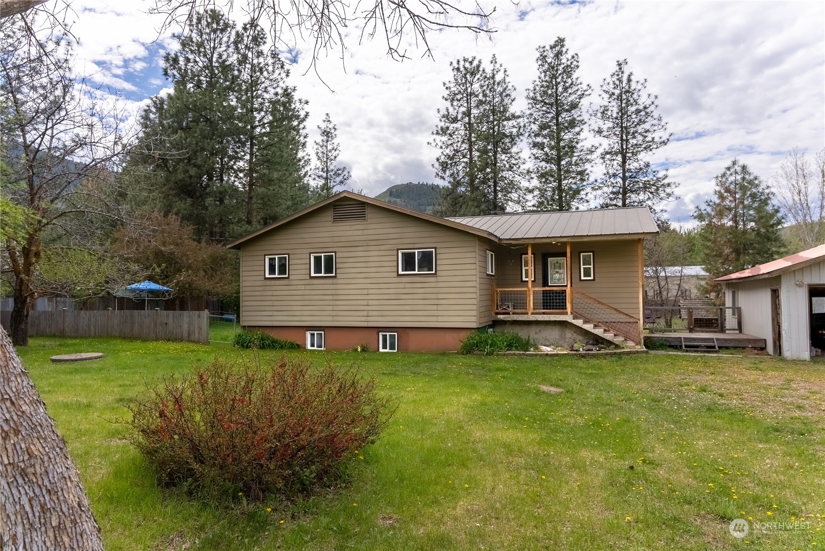 36 Twisp Airport Road Twisp, WA 98856 - Photo 36 of 38 a view of a house with a yard