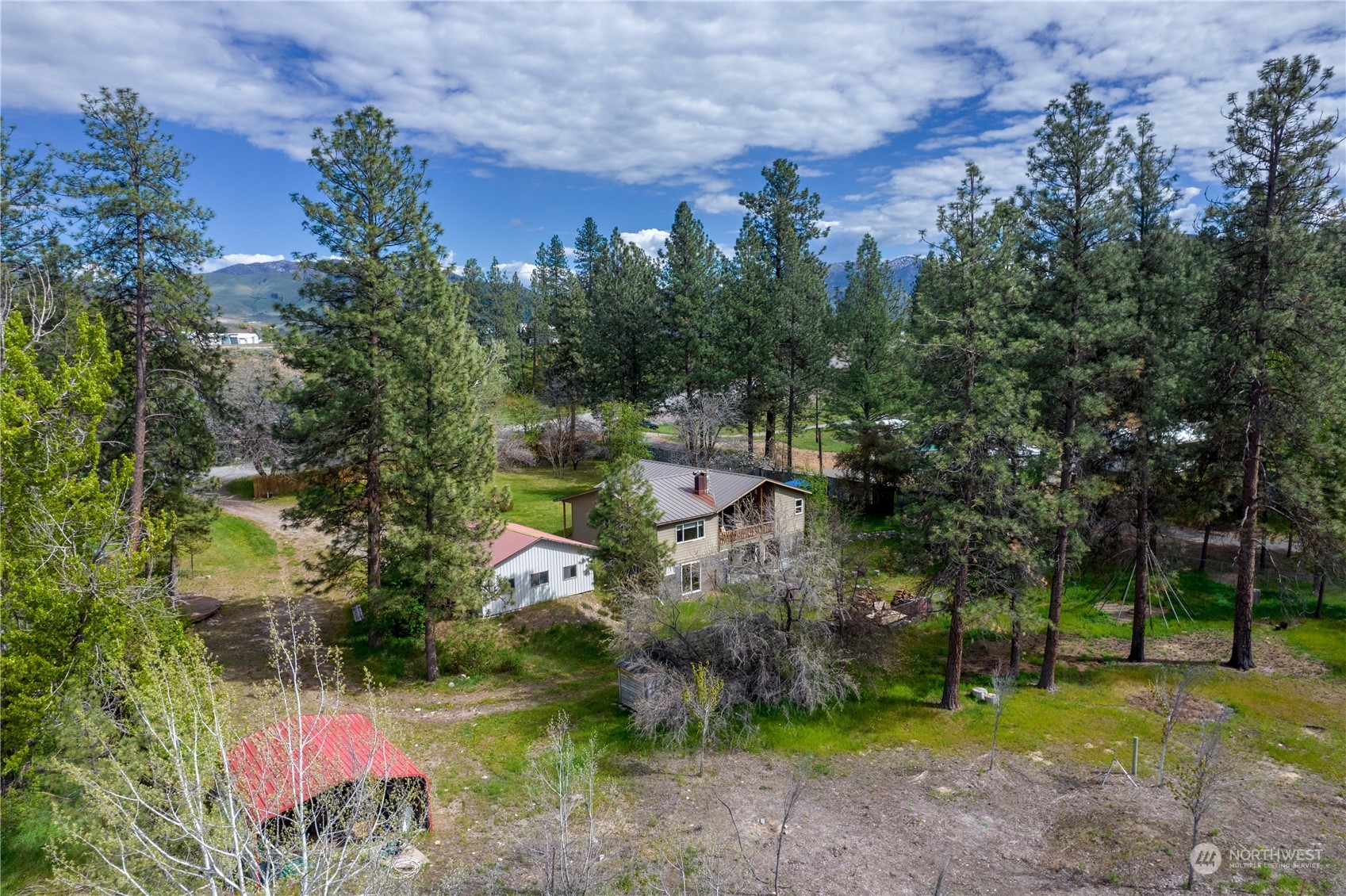36 Twisp Airport Road Twisp, WA 98856 - Photo 6 of 38 an aerial view of residential house with outdoor space and trees all around