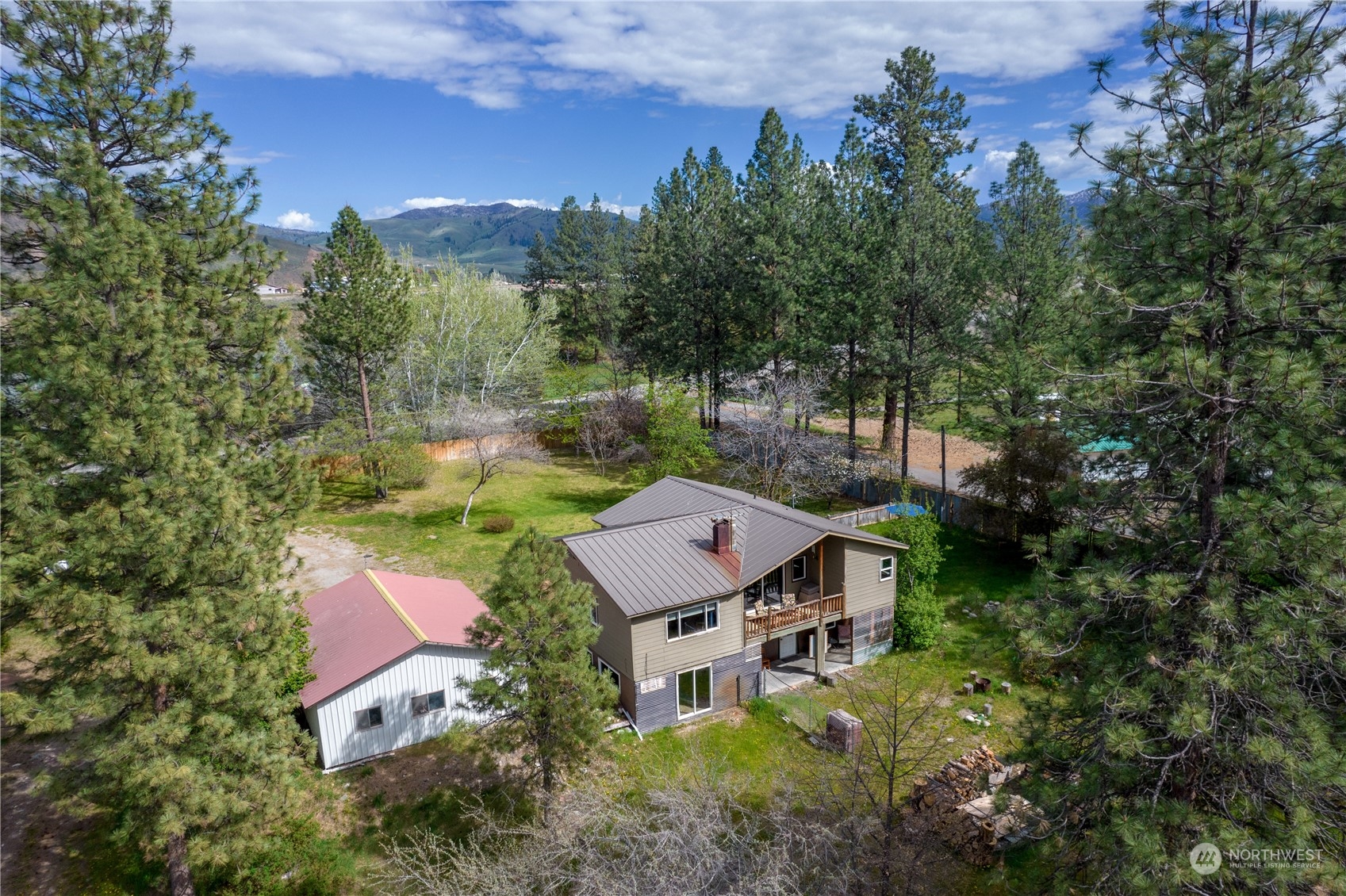 36 Twisp Airport Road Twisp, WA 98856 - Photo 8 of 38 an aerial view of a house with swimming pool and garden view