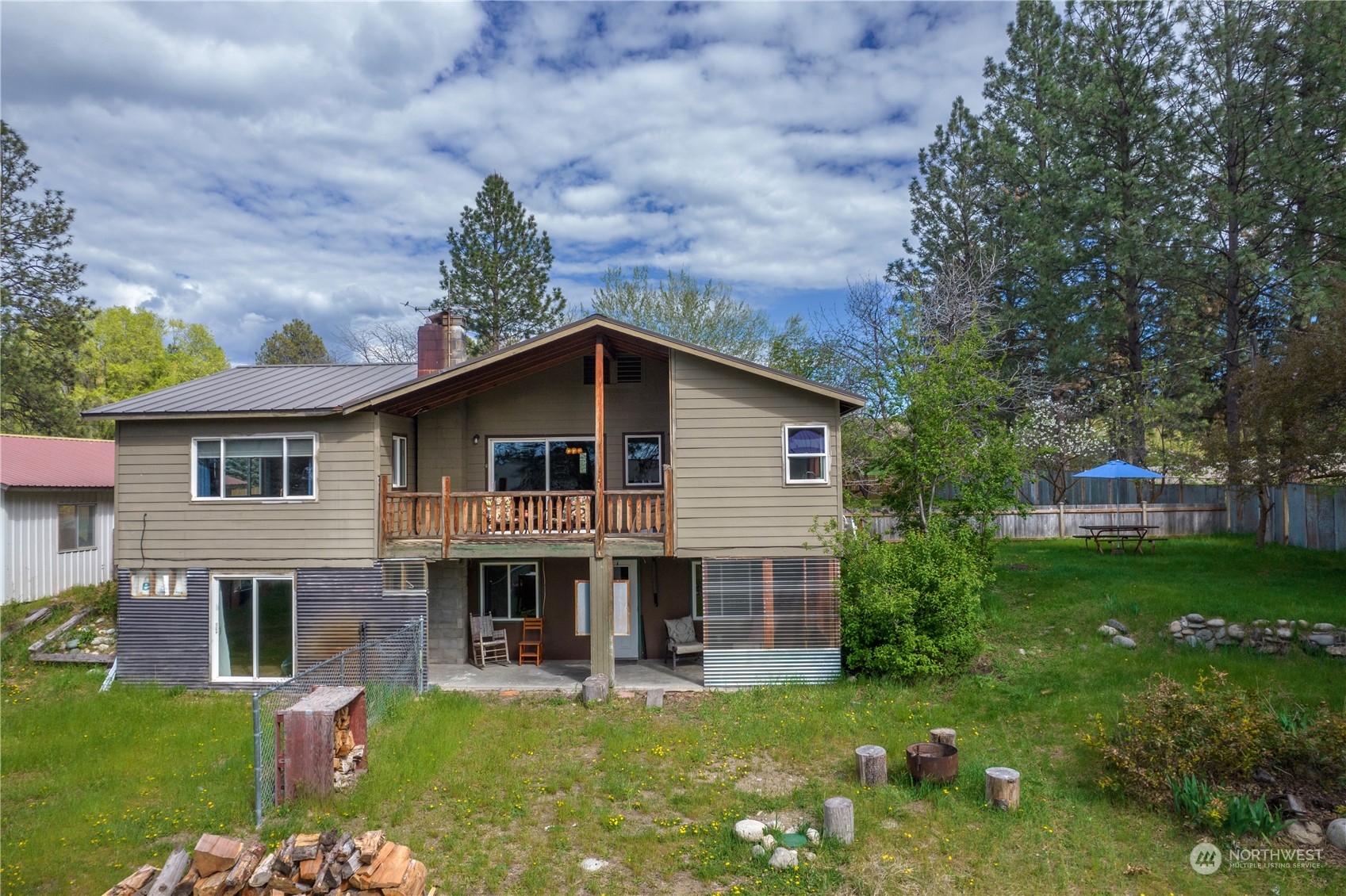 36 Twisp Airport Road Twisp, WA 98856 - Photo 9 of 38 a view of a house with a yard porch and sitting area