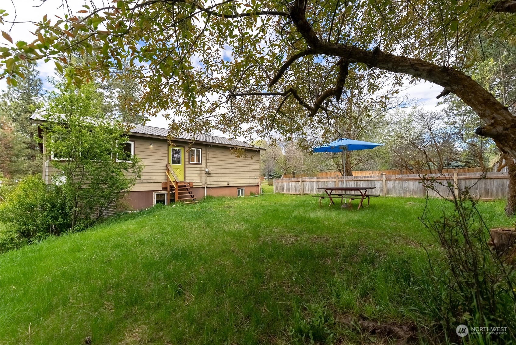 36 Twisp Airport Road Twisp, WA 98856 - Photo 10 of 38 a view of a house with a yard