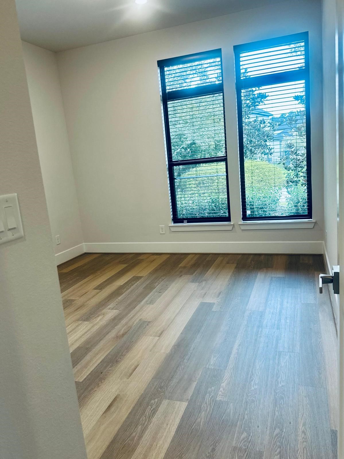 6 Gentle Branch Place Tomball, TX 77375 - Photo 34 of 46 a view of room with window and hardwood