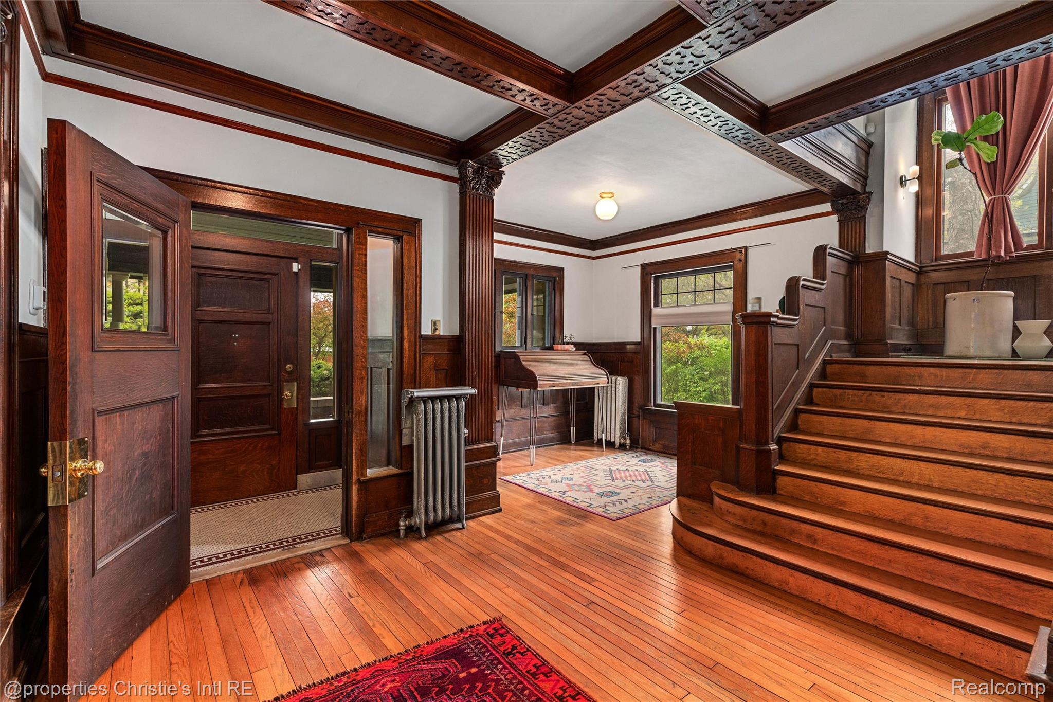 36 Longfellow Street Detroit, MI 48202 - Photo 7 of 81 Entryway with a wainscoted wall, light wood finished floors, radiator heating unit, coffered ceiling, and crown molding