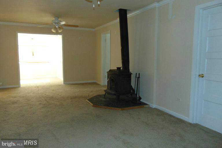 2262 Monocacy Road Essex, MD 21221 - Photo 7 of 18 Living Room w/WoodBurning Stove