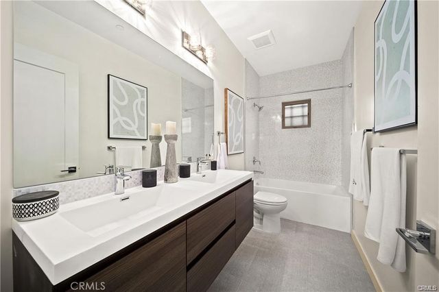 a bedroom with bed and window