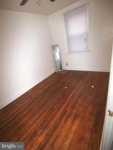 2829 Round Road Baltimore, MD 21225 - Photo 4 of 11 a view of empty room with wooden floor