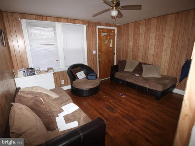 2829 Round Road Baltimore, MD 21225 - Photo 7 of 11 a living room with furniture and a potted plant