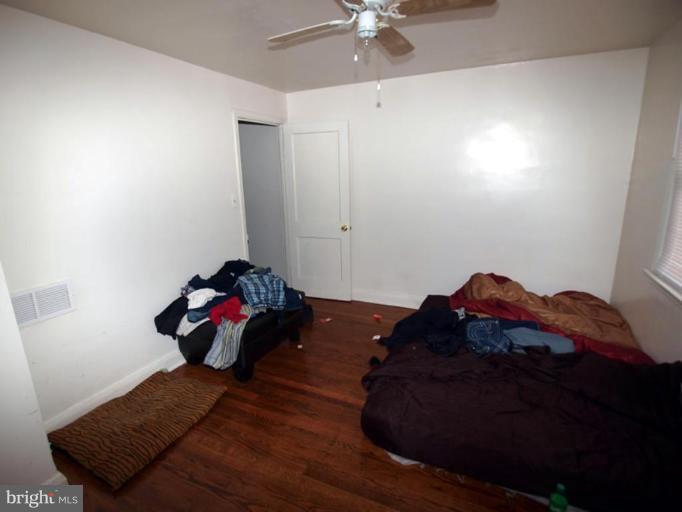2829 Round Road Baltimore, MD 21225 - Photo 8 of 11 a bedroom with a bed and window
